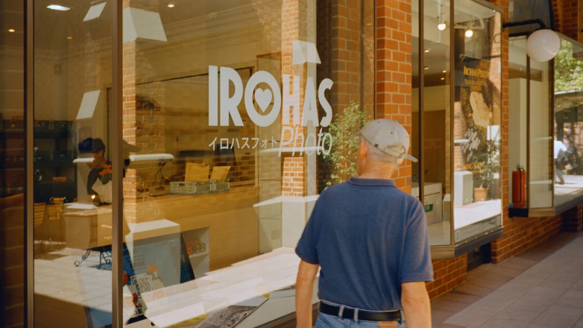 A passer-by looking into the Perth lab in Trinity Arcade